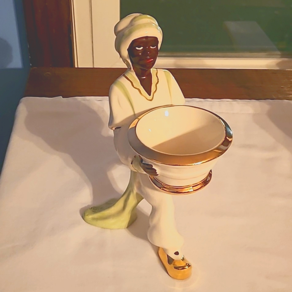 Vintage Blackamoore ring bearer Figurine. Gold trim bowl with green sash.